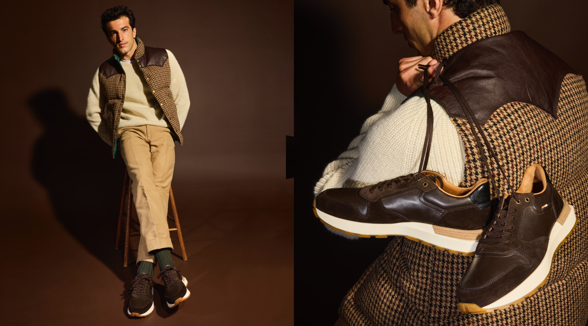 A man holding a pair of brown lace up sneakers by the laces over his shoulder. / Un homme tenant une paire de baskets marron à lacets par les lacets sur son épaule.