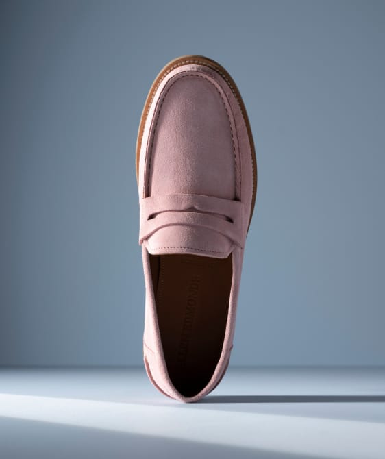 Men’s gray textured leather sneaker with tan rubber sole and brown leather lining